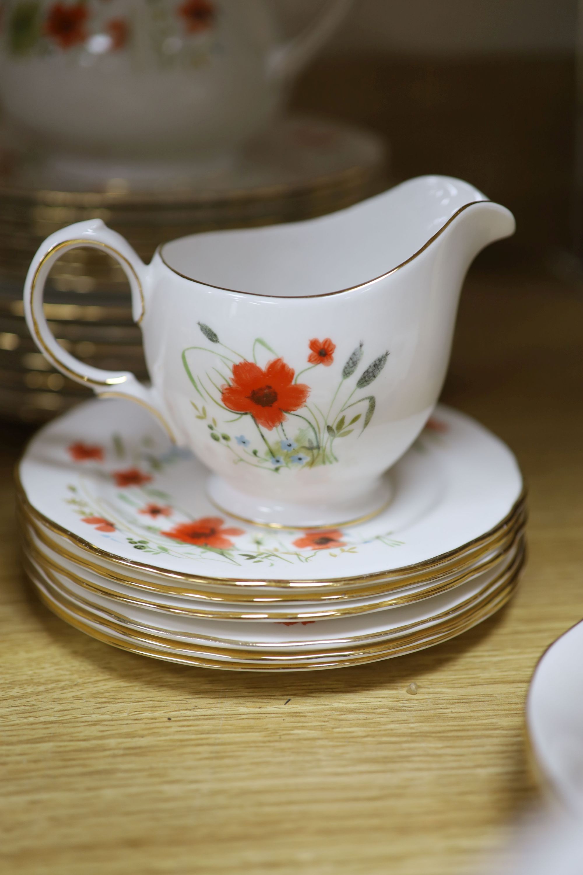 A Colclough floral decorated fifty nine piece part tea service